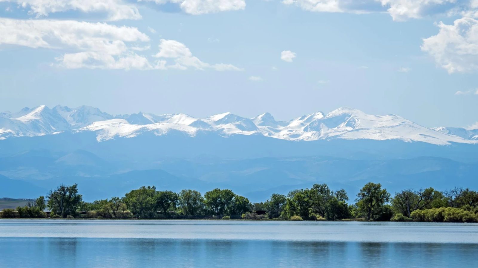 A reservoir near Brighton, Colorado with the snow-capped Front Range beyond