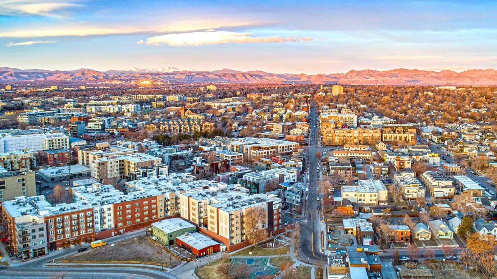 Aerial view of Aurora, Colorado neighbourhoods with the Front Range at sunset