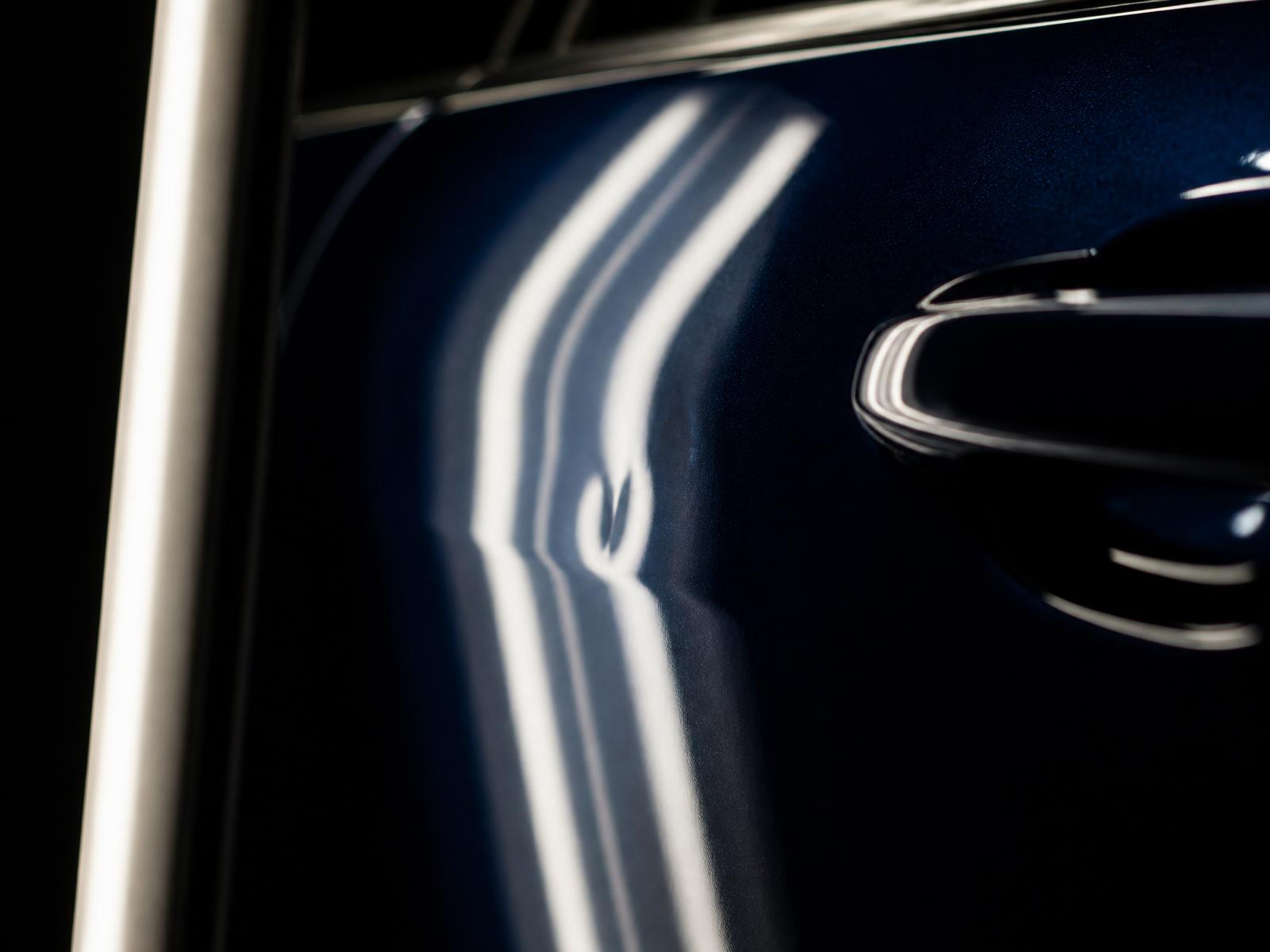 Close macro view of a dent read under angled light