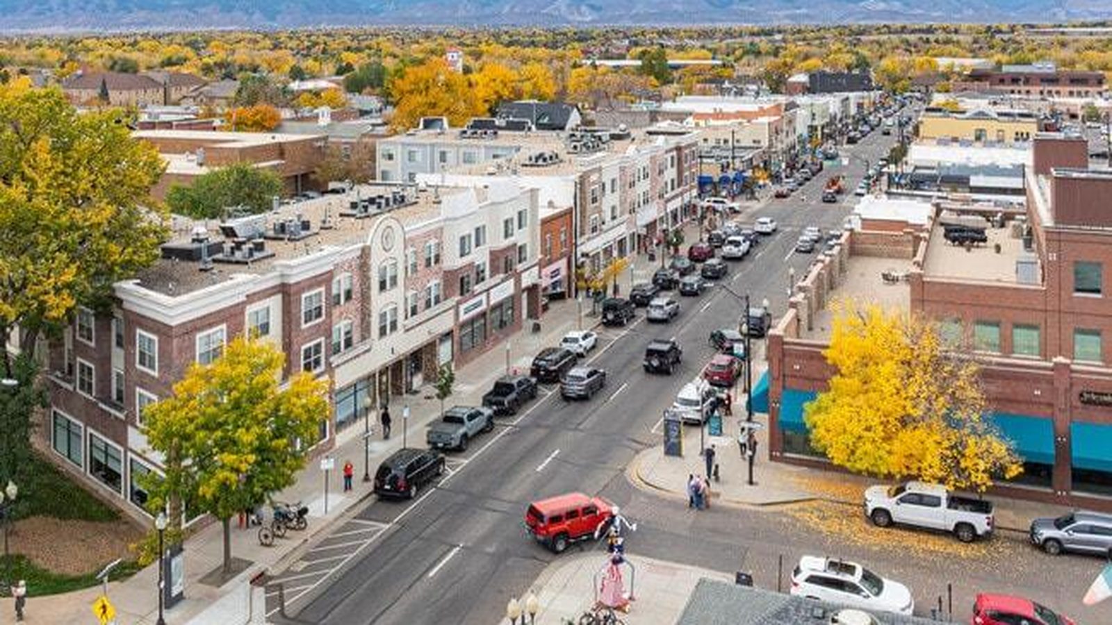 Aerial view of historic Main Street in downtown Littleton, Colorado with the foothills beyond