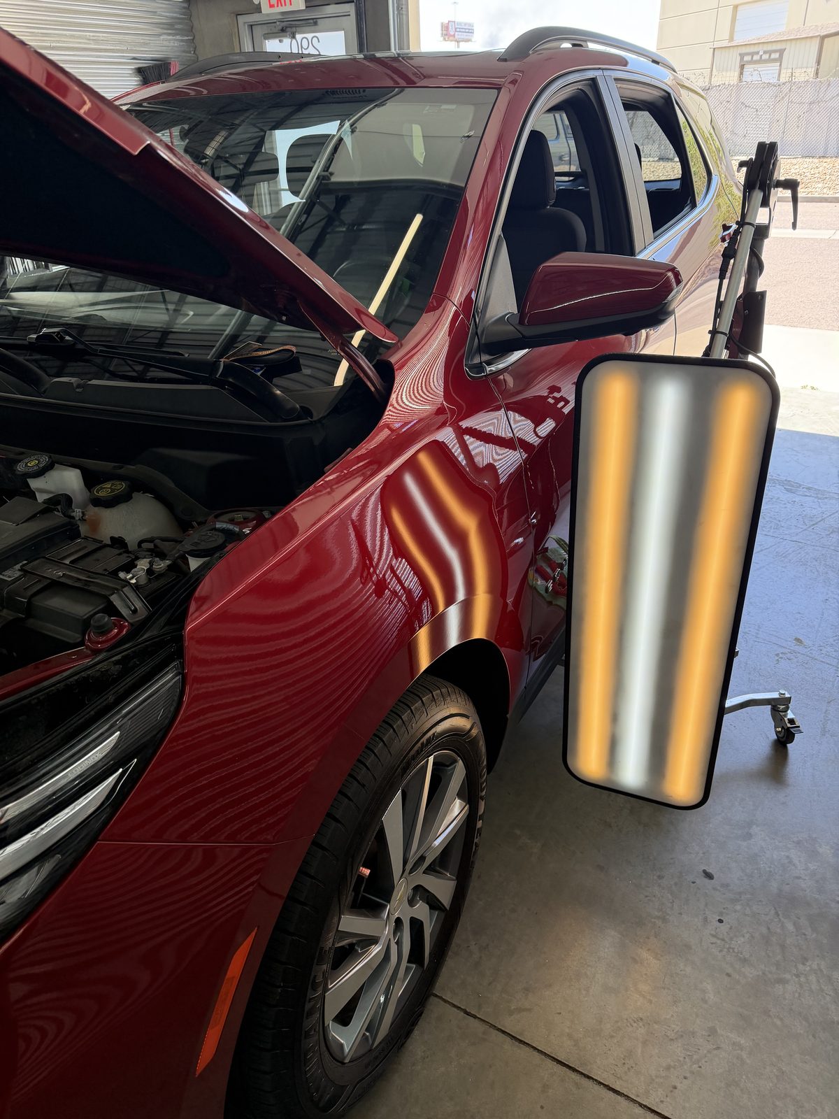 Paintless dent repair bay at the Colorado Dent Solutions Denver shop