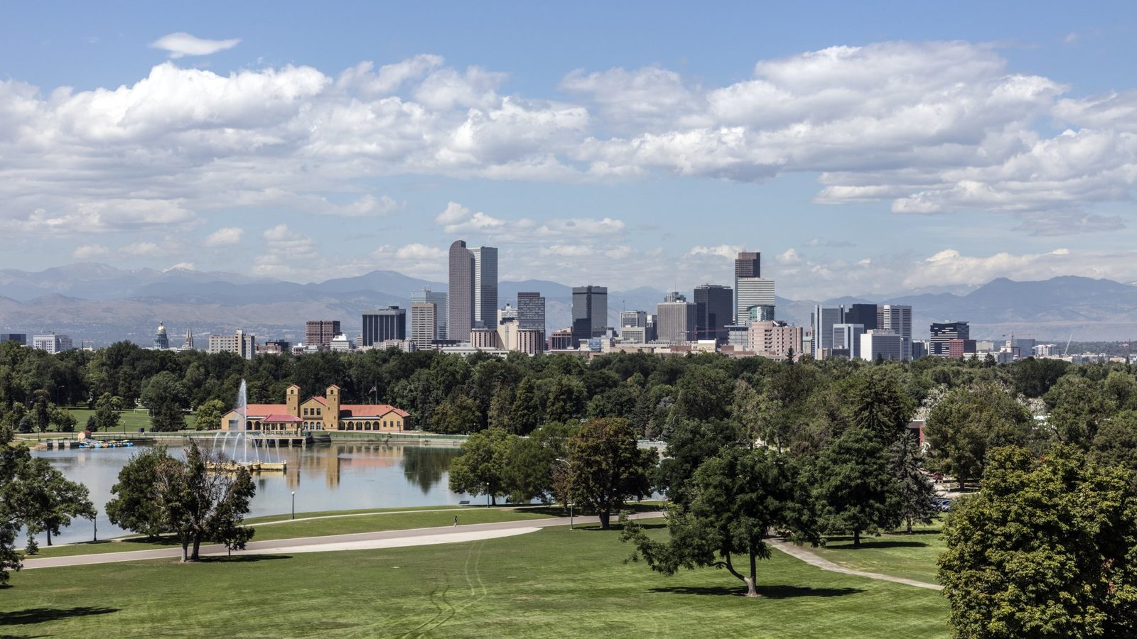 The downtown Denver skyline and the Front Range seen across City Park